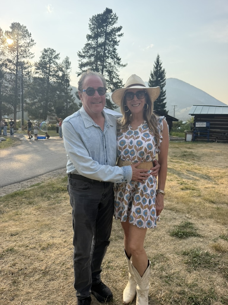 Gina and her husband at sunset in Big Sky, Montana
