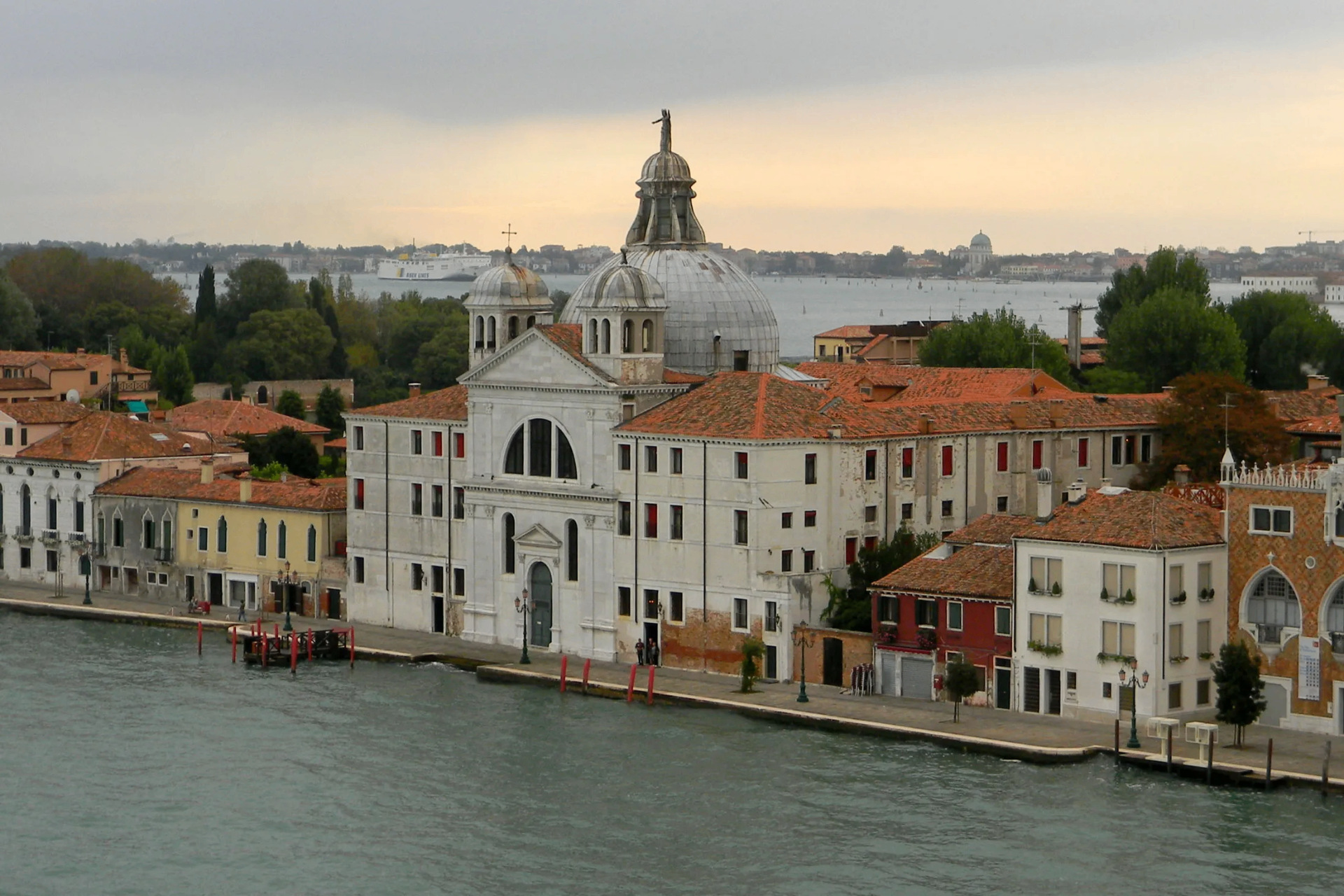 The Airelles Palladio Venezia complex on Giudecca Island, seen from the water at dusk